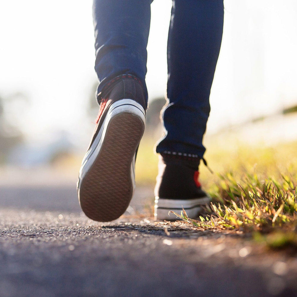 Person walking in lifestyle shoes.